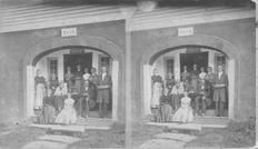 SA0154 - Members of the South Family, twelve men and women in the archway of building. There is an ad on the back for other views., Winterthur Shaker Photograph and Post Card Collection 1851 to 1921c